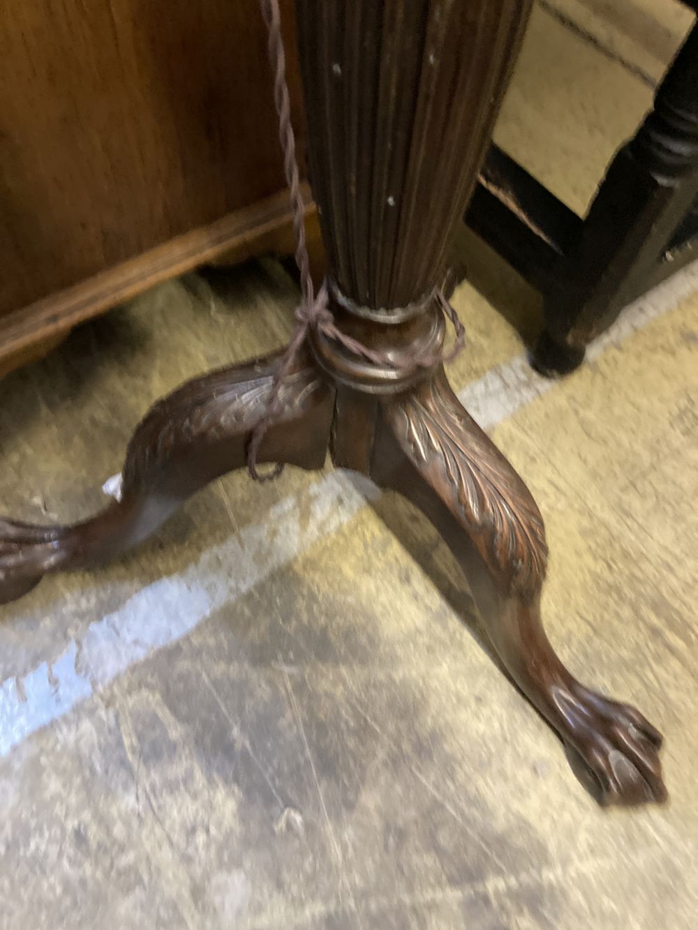 A Victorian mahogany tripod wine table, diameter 50cm height 70cm, together with a carved standard lamp